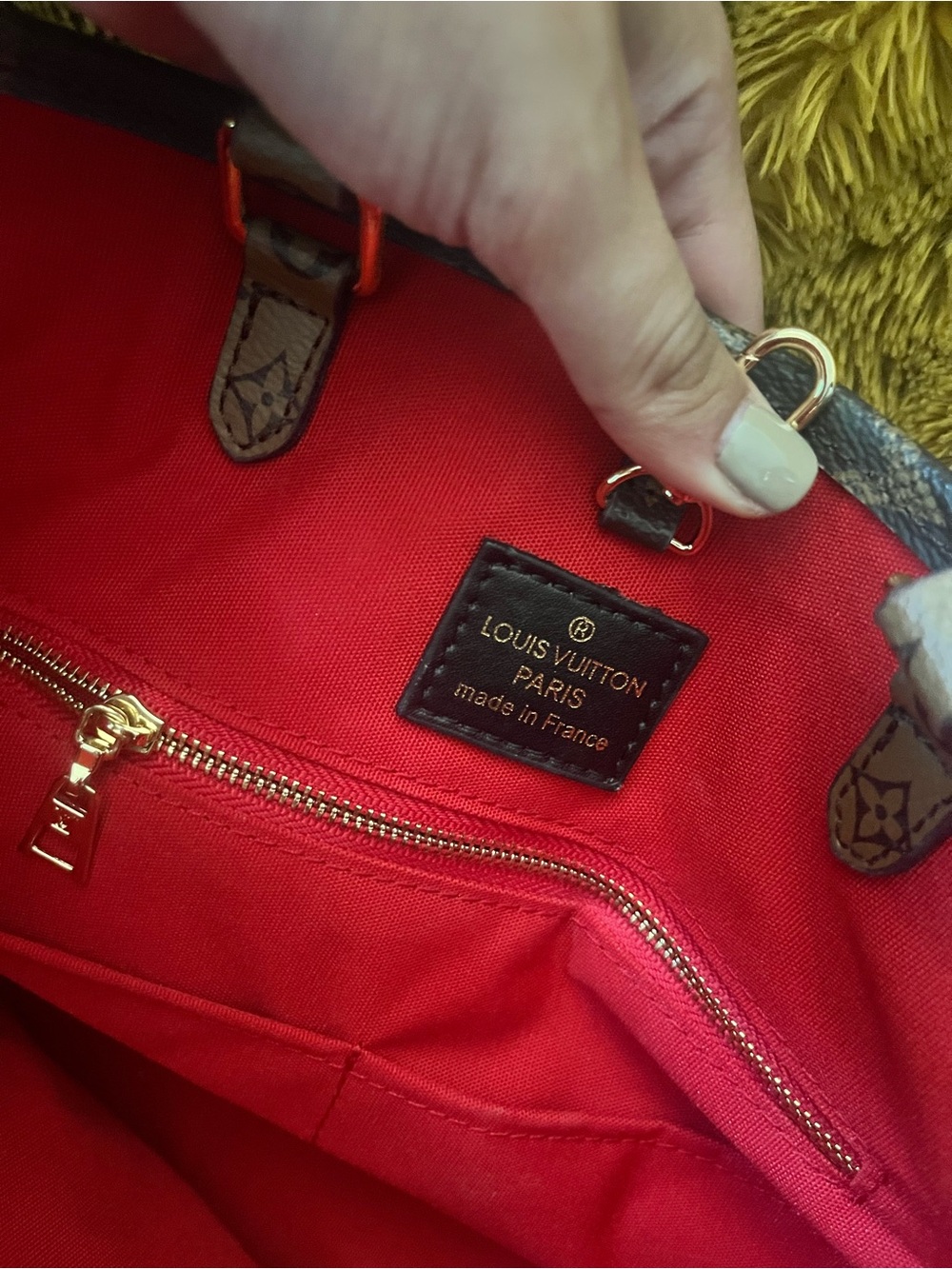 Louis Vuitton on the go MM Red Interior Monogram Tote with Gold Hardware.